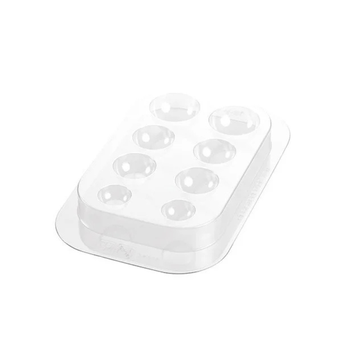 Moule en plastique transparent avec huit empreintes rondes de différentes tailles pour créer les yeux et les pattes d’un renne pâtissier.