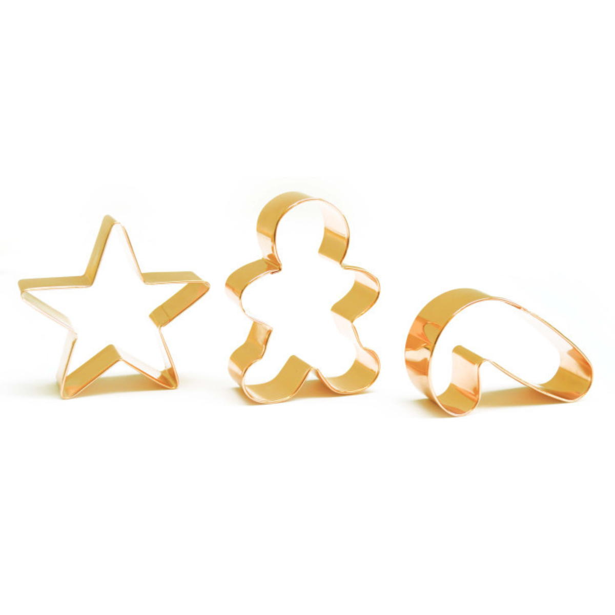 Trois emporte-pièces en inox doré ScrapCooking pour biscuits de Noël, en forme d’étoile, de bonhomme pain d’épices et de sucre d’orge, présentés sur fond blanc.